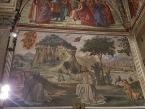 Domenico Ghirlandaio, cappella Sassetti, Scena di san Francesco che riceve le stimmate. Sullo sfondo la rocca della Verna e a destra la città di Pisa